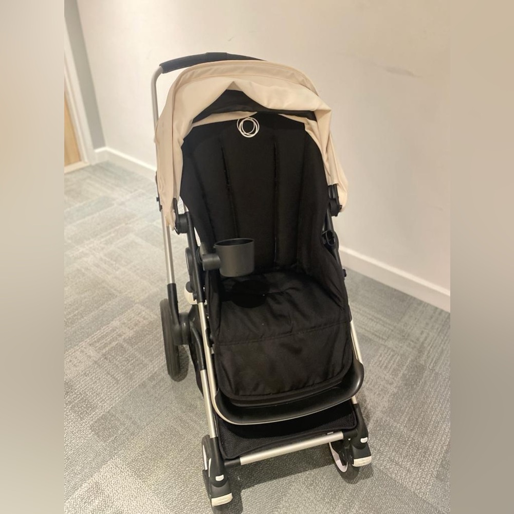 Black Bugaboo Fox 2 with cream colored canopy